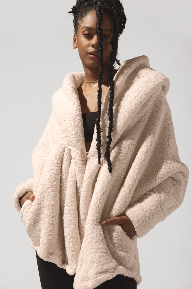 Cocoon fur coats on sale and fringe wraps